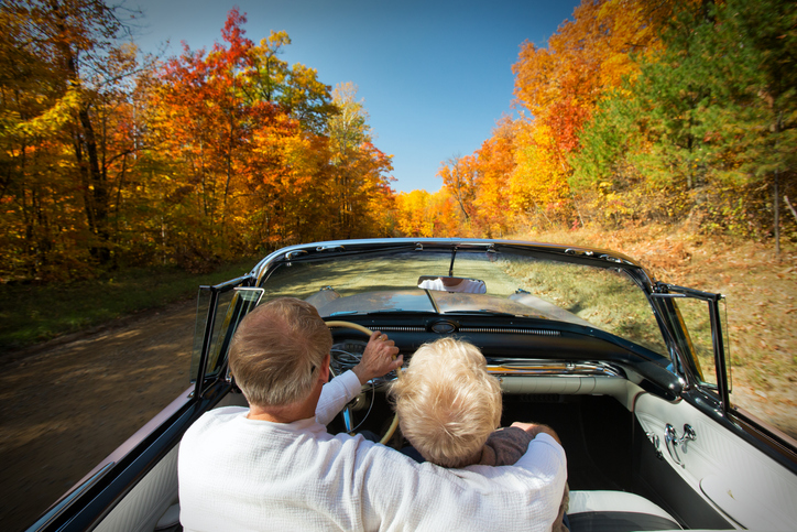 Retired couple enjoying an Autumn drive.